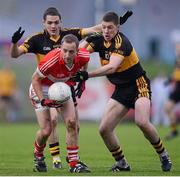 28 October 2012; Paul Devane, Dingle, in action against Brian Looney and Kieran O'Leary, right, Dr. Crokes. Kerry County Senior Football Championship Final, Dingle v Dr. Crokes, Austin Stack Park, Tralee, Co. Kerry. Picture credit: Stephen McCarthy / SPORTSFILE