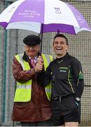 28 October 2012; Match referee Maurice Deegan takes shelter under John Salley's umberella before the game. AIB Leinster GAA Football Senior Club Championship, First Round, St Patrick's v Éire Óg, County Grounds, Aughrim, Co. Wicklow. Picture credit: Ray McManus / SPORTSFILE