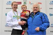 29 October 2012; Winner of the national women's marathon championships Maria McCambridge, and her son Dylan, with Georgina Drumm, Vice President, Athletics Association of Ireland, after during the Dublin Marathon 2012. Merrion Square, Dublin. Picture credit: Brendan Moran / SPORTSFILE