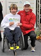 29 October 2012; Third placed athlete in the wheelchair race Paul Hannon, Northern Ireland, is presented with his award by Jim Aughney, Race Director, after the Dublin Marathon 2012. Merrion Square, Dublin. Picture credit: Brendan Moran / SPORTSFILE