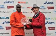 29 October 2012; Second placed athlete in the elite men's race Robert Kipchumba, Kenya, is presented with his award by Alex Sweeney, Chairman of the BHAA and the Dublin Marathon, after the Dublin Marathon 2012. Merrion Square, Dublin. Picture credit: Brendan Moran / SPORTSFILE