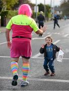 29 October 2012; Five year old Oliver Geoghan, from Clonskeagh, Dublin, offers a 'high five' to Dublin marathon competitor Christopher Jones, from Tallaght, Co. Dublin, as he makes his way along Clonskeagh Rd during the Dublin Marathon 2012. Picture credit: Ray McManus / SPORTSFILE