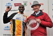 29 October 2012; Winner of the elite men's race Geofrey Ndungu, Kenya, is presented with his award by Alex Sweeney, Chairman of the BHAA and the Dublin Marathon, after the Dublin Marathon 2012. Merrion Square, Dublin. Picture credit: Brendan Moran / SPORTSFILE