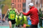 29 October 2012; Barry Minnock, Co. Offaly, is congratulated by race director Jim Aughney on coming in 3rd place in the national marathon championships during the Dublin Marathon 2012. Merrion Square, Dublin. Picture credit: Brendan Moran / SPORTSFILE