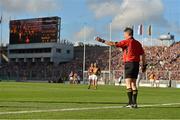 30 September 2012; Linesman Barry Kelly holds out a sliothar for a player to take a sideline cut. GAA Hurling All-Ireland Senior Championship Final Replay, Kilkenny v Galway, Croke Park, Dublin. Picture credit: Brendan Moran / SPORTSFILE