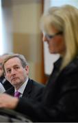 3 November 2012; An Taoiseach Enda Kenny TD listens to the keynote speaker Karen Leach at the Code of Ethics & Good Practice for Children’s Sport Information Day, hosted by the Irish Sports Council, at the Crowne Plaza Hotel, Blanchardstown, Dublin. Picture credit: Ray McManus / SPORTSFILE