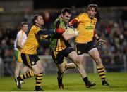 3 November 2012; Paul Durcan, Donegal, in action against Martin Penrose and Joe McMahon, right, Ulster Football Selection XV. Match for Michaela, Donegal v Ulster Football Selection XV, Casement Park, Belfast, Co. Antrim. Picture credit: Matt Browne / SPORTSFILE