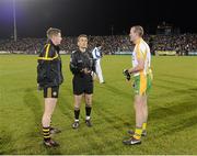 3 November 2012; Referee Maurice Deegan tosses the coin between Ulster Football Selection XV captain Darren Hughes, left, and Donegal captain Neil Gallagher. Match for Michaela, Donegal v Ulster Football Selection XV, Casement Park, Belfast, Co. Antrim. Picture credit: Matt Browne / SPORTSFILE