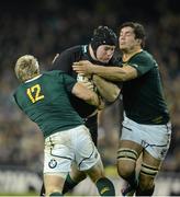 10 November 2012; Michael Bent, Ireland, is tackled by Jean de Villiers, left, and Francois Louw, South Africa. Autumn International, Ireland v South Africa, Aviva Stadium, Lansdowne Road, Dublin. Picture credit: Stephen McCarthy / SPORTSFILE