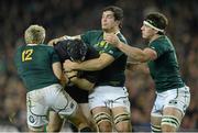10 November 2012; Michael Bent, Ireland, is tackled by South Africa players, from left, Jean de Villiers, Francois Louw and Marcell Coetzee. Autumn International, Ireland v South Africa, Aviva Stadium, Lansdowne Road, Dublin. Picture credit: Stephen McCarthy / SPORTSFILE