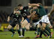 10 November 2012; Cian Healy, Ireland, is tackled by Duane Vermeulen, Pat Cilliers and Marcell Coetzee, South Africa. Autumn International, Ireland v South Africa, Aviva Stadium, Lansdowne Road, Dublin. Picture credit: Ray McManus / SPORTSFILE