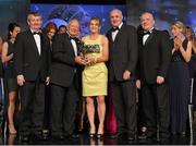 10 November 2012; Briege Corkery, Cork, is presented with the Senior Players' Player of the Year award by Pat Quill, President, Ladies Gaelic Football Association, in the company of, from left, Pol O Gallchoir, Ceannsaí, TG4,  Liam Moggan, National Coach Development Officer, Coaching Ireland, and Cormac Farrell, O'Neill's. TG4 O'Neill's Ladies Football All-Star Awards 2012, Citywest Hotel, Saggart, Co. Dublin. Picture credit: Brendan Moran / SPORTSFILE