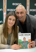 11 November 2012; Olympic Boxing Champion Katie Taylor with her father and coach Pete while signing her new book 'My Olympic Dream' in Easons O'Connell Street. Katie's new book is available from today in all Easons stores nationwide and on easons.com. Katie Taylor Book Signing, Easons, O'Connell Street, Dublin. Picture credit: Stephen McCarthy / SPORTSFILE
