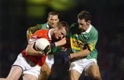 1 February 2003; Nicholas Murphy, Cork, in action against Kerry's John Sheehan. Cork v Kerry, National Football League Division 1A, Pairc Ui Rinn, Co. Cork. Picture credit; Ray McManus / SPORTSFILE *EDI*