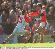 9 February 2003; Enda McNulty, Armagh, is tackled by Cork corner forward  Colin Crowley. Allianz National Football League Division 1A, Armagh v Cork, St. Oliver Plunkett Park, Crossmaglen, Co. Armagh. Picture credit; Ray McManus / SPORTSFILE