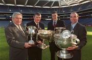 11 February 2003; Dr. Tim O'Mahony, Chairman, Toyota Ireland, Sean McCague, Presdident of the GAA, Ciaran Whelan, Dublin, and D.J. Carey, Kilkenny, are photographed with The Andy Merrigan Cup, Club Football, The Tommy Moore Cup, Club Hurling, The Liam MacCarthy Cup, Senior Hurling, The Sam Maguire Cup, Senior Football, The Dr. Croke Cup, Hurling League, and The Football League Trophy, when Toyota Ireland announced a major sponsorship with the G.A.A. which will benefit player funds and see Toyota become 'The Official car supplier to the GAA', at Croke Park, Dublin. Picture credit; Ray McManus / SPORTSFILE