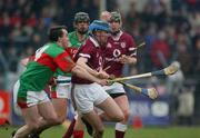 16 February 2003; Brian Hanley, Athenry, is tackled by Birr's Johnny Pilkington. St Mary's, Athenry v Birr, AIB All-Ireland Club Hurling Championship Semi-Final, Cusack Park, Ennis, Co. Clare. Hurling. Picture credit; Ray McManus / SPORTSFILE *EDI*