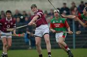 16 February 2003; Eugene Cloonan, Athenry, in action against Birr's Brian Whelahan. St Mary's, Athenry v Birr, AIB All-Ireland Club Hurling Championship Semi-Final, Cusack Park, Ennis, Co. Clare. Hurling. Picture credit; Ray McManus / SPORTSFILE *EDI*