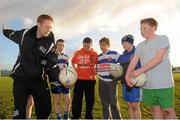 10 November 2012; Pictured at the inaugural AIB GAA Skills Day at Navan O’Mahonys GAA is Colm Cooper demonstrating the hand pass to, from left, Craig Munnelly, Niall Kearney, Killian Clarke, Kyle Johnston and Harry Deane. AIB, proud sponsors of the GAA Club Championships joined up with the Cavan football Champions to celebrate the club’s county success and acknowledge the role which the club plays in the community by supporting them in hosting the first ever AIB GAA Skills event. Navan O’Mahonys GAA Club, Co. Meath. Picture credit: Pat Murphy / SPORTSFILE