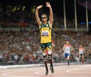 7 September 2012; Oscar Pistorius, South Africa, in action waves to the crowd after winning heat 2 of the Men's 400m - T44. London 2012 Paralympic Games, Athletics, Olympic Stadium, Olympic Park, Stratford, London, England. Picture credit: Brian Lawless / SPORTSFILE