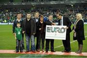 14 November 2012; UEFA President Michel Platini and Robert Finnegan, Chief Executive of 3, fourth from left, make a presentation to the family of James Nolan before the game. Friendly International, Republic of Ireland v Greece, Aviva Stadium, Lansdowne Road, Dublin. Picture credit: David Maher / SPORTSFILE