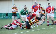 17 November 2012; Mark Feeley, Lansdowne, scores a try for his side despite the efforts of Niall Kenneally and Tom Burke, UL Bohemian. Ulster Bank League Division 1A, Lansdowne v UL Bohemian, Aviva Stadium, Lansdowne Road, Dublin. Picture credit: Matt Browne / SPORTSFILE