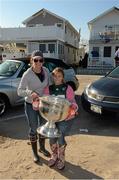 17 November 2012; Ann Marie Campbell and her daughter Julia with the Sam Maguire Cup when  members of the 2012 GAA GPA All Stars visited Breezy Point's Irish Community following the devastation caused by Hurricane Sandy. The GPA is assisting in the provision of playing gear and sports equipment for the area's Catholic Youth Organisation's sports programme. Breezy Point, Queens, New York, NY, United States. Picture credit: Ray McManus / SPORTSFILE