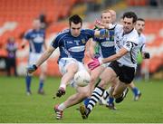 18 November 2012; Kevin Niblock, St Gall's, in action against Aidan Branagan, Kilcoo. AIB Ulster GAA Football Senior Championship Semi-Final, St Gall's, Antrim v Kilcoo, Down, Athletic Grounds, Armagh. Picture credit: Oliver McVeigh / SPORTSFILE