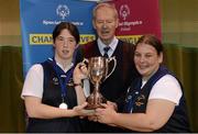 24 November 2012; Former RTE GAA commentator Michéal O Muircheartaigh presents the Women's National Basketball Cup to Blue Dolphin Special Olympics Club, Wicklow, joint captains Julieanne Moran, left and Caitriona Brady. 2012 Special Olympics Ireland National Women's Basketball Cup, Gormanston College, Co. Meath. Photo by Sportsfile