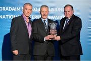 24 November 2012; Referee Paddy Russell, from Tipperary, is presented with his Hall of Fame Award award by Uachtarán Chumann Lúthchleas Gael Liam Ó Néill, right, and Pat McEnaney, Chairman of the National Referees Committee. 2012 National Referees' Awards Banquet, Croke Park, Dublin. Picture credit: Barry Cregg / SPORTSFILE