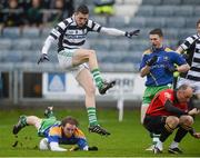 25 November 2012; Adrian Kelly, Portlaoise, has his shot blocked by Padraig McComack, Emmet Og Killoe, as referee Cormac Reilly stoops out of the way. AIB Leinster GAA Football Senior Championship Semi-Final, Portlaoise, Laois v Emmet Og Killoe, Longford, O'Moore Park, Portlaoise, Co. Laois. Picture credit: Brian Lawless / SPORTSFILE