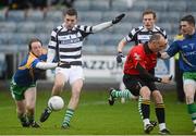 25 November 2012; Adrian Kelly, Portlaoise, has his shot blocked by Padraig McComack, Emmet Og Killoe, as referee Cormac Reilly stoops out of the way. AIB Leinster GAA Football Senior Championship Semi-Final, Portlaoise, Laois v Emmet Og Killoe, Longford, O'Moore Park, Portlaoise, Co. Laois. Picture credit: Brian Lawless / SPORTSFILE