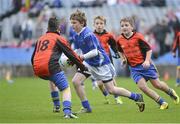 26 November 2012; Paraic Mac Lochlainn, Gaelscoil Thaobh na Coille, centre, in action against Jordan Needham, left, and Jack O'Leary, right, Our Lady’s / Queen of Angels. Allianz Cumann na mBunscol Finals, Gaelscoil Thaobh na Coille v Our Lady’s / Queen of Angels, Croke Park, Dublin. Picture credit: Barry Cregg / SPORTSFILE