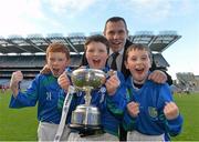 27 November 2012; St Oliver Plunkett Malahide players, from left, Sean Guiden, Liam Foley, and Denis Smith, with former Dublin footballer Ciaran Whelan, Allianz, after he presented them with the cup. Allianz Cumann na mBunscol Finals, St Oliver Plunkett Malahide v St Patrick’s Hollypark. Some 1,200 players took part over the two day finals. Croke Park, Dublin. Picture credit: Brian Lawless / SPORTSFILE