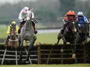 2 December 2012; Jezki, with Barry Geraghty up, second from right, jumps the last alongside eventual second place Champagne Fever, left, with Ruby Walsh up, and eventual third place Zuzka, with Paul Townend up, on their way to winning the Bar One Racing Royal Bond Novice Hurdle. Fairyhouse Racecourse, Co. Meath. Picture credit: Matt Browne / SPORTSFILE