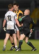2 December 2012; Linesman Barry Cassidy intervenes in a confrontation between Darragh O'Hanlon, Kilcoo, and Aaron Cunningham, Crossmaglen Rangers, during the game. AIB Ulster GAA Football Senior Club Championship Final, Crossmaglen Rangers, Armagh v Kilcoo, Down, Athletic Grounds, Armagh. Photo by Sportsfile