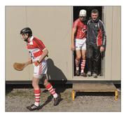 18 March 2012; Back to basics. Dónal Óg Cusack, Pa Cronin and team manager Jimmy Barry Murphy emerge from prefab temporary dressing rooms at Páirc Uí Chaoimh for a game with Galway. Picture credit: Stephen McCarthy / SPORTSFILE from A Season of Sundays 2012  This image may be reproduced free of charge when used in conjunction with a review of the book &quot;A Season of Sundays 2012&quot;. All other usage © SPORTSFILE
