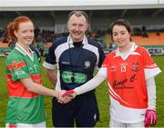 2 December 2012; The Carnacon captain Noelle Tiernan, left, and the Donaghmoyne captain Cathriona McConnell shake hands accross referee John Nyland before the game. TESCO HomeGrown All-Ireland Senior Club Final, Carnacon, Mayo v Donaghmoyne, Monaghan, Ballinamore, Leitrim. Picture credit: Ray McManus / SPORTSFILE