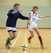 5 December 2012; Elien Coyle, Mercy College, Sligo, in action against Leanne Kierwan, Bailieborough CS, Co. Cavan. FAI All-Ireland Post Primary Schools First Year Futsal Finals. Franciscan College, Sports Centre, Gormanston, Meath. Picture credit: David Maher / SPORTSFILE