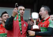 9 December 2012; Simon Lawlor, centre, Ballymun Kickhams, along with Ted Furman, left, and Kevin Leahy, right, holds the McCabe Cup in his left hand and the handle in his right, after it came apart during the presentation. AIB Leinster GAA Football Senior Club Championship Final, Portlaoise, Laois v Ballymun Kickhams, Dublin, Cusack Park, Mullingar, Co. Westmeath. Picture credit: David Maher / SPORTSFILE