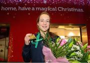 10 December 2012; Team Ireland's Fionnuala Britton who won two gold medals, one in the Senior Women's race and the other as a member of the overall winning team at the SPAR European Cross Country Championships in Budapest, Hungary, pictured on her return at Dublin Airport. Picture credit: David Maher / SPORTSFILE