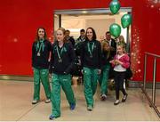 10 December 2012; Fionnuala Britton, Team Ireland, leads out her team-mates Linda Byrne, left, and Ava Hutchinson, right, pictured at Dublin Airport on their return from SPAR European Cross Country Championships in Budapest. Dublin Airport, Dublin. Picture credit: David Maher / SPORTSFILE