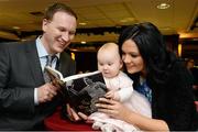 12 December 2012; Author Donal McAnallen with his wife Pauline and daughter Ailbhe, aged 8 months, in attendance at the Comhairle Ardoideachais book launch &quot;The Cups that Cheered&quot; - A History of Higher Education Gaelic Games by Donal McAnallen. The Mont Clare Hotel, Dublin. Picture credit: David Maher / SPORTSFILE