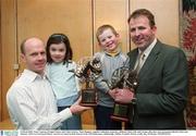 3 March 2003; Peter Canavan, Errigal Ciaran, and Colin Corkery, Nemo Rangers, together with their respective children Claire, left, and Cormac after they were presented with the Ulster and Munster AIB GAA Provincial Player Awards at a lunch in their honour in the AIB Bankcentre, Ballsbridge, Dublin. Football. Picture credit; Ray McManus / SPORTSFILE