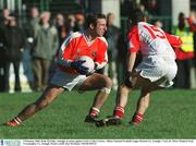 9 February 2003; Enda McNulty, Armagh, in action against Cork's Colin Crowley. Allianz National Football League Division 1A, Armagh v Cork, St. Oliver Plunkett Park, Crossmaglen, Co. Armagh. Picture credit; Ray McManus / SPORTSFILE