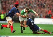 8 March 2003; Ireland's Kevin Maggs is tackled by Fabien Pelous, left and Damien Traille. RBS Six Nations Rugby Championship, Ireland v France, Lansdowne Road, Dublin. Picture credit; Brendan Moran / SPORTSFILE