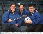 9 March 2003; Adrian Fleming UCD, left, shows off his hurling skills to Michelle Ross, Waterford IT, and The Carphone Warehouse Sponsored GPA Chief Executive Dessie Farrell at Parnell Park, Dublin after both students received their Azzurri Scholarship Awards which included a bursary and Azzurri playing gear. Picture credit; David Maher / SPORTSFILE