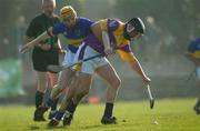 16 March 2003; Darren Stamp, Wexford, in action against Tipperary's Lar Corbett. Allianz National Hurling League, Tipperary v Wexford, McDonagh Park, Nenagh, County Tipperary. Picture credit; Ray McManus / SPORTSFILE *EDI*