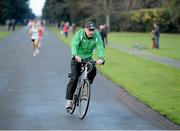 25 December 2012; Three time Olympian, Nation and Dublin Marathon Champion Dick Hooper cycles the Raheny Shamrock A.C. Christmas Morning Dash, GOAL Mile Christmas Day 2012, St Annes Park, Raheny,  Dublin. Picture credit: Ray McManus / SPORTSFILE