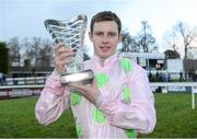 26 December 2012; Jockey Paul Townend holds up the winning trophy after he rode Arvika Ligeonniere, to win the Racing Post Novice Steeplechase. Leopardstown Christmas Racing Festival 2012, Leopardstown Racetrack, Leopardstown, Co. Dublin. Picture credit: Barry Cregg / SPORTSFILE